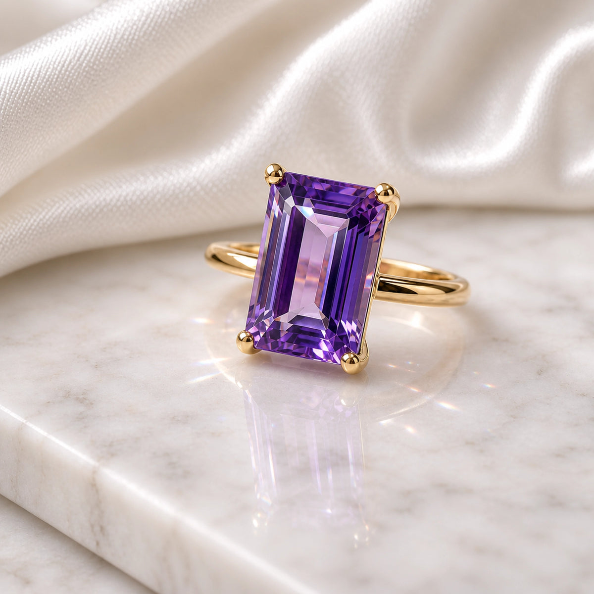 Amethyst emerald-cut solitaire ring in yellow gold