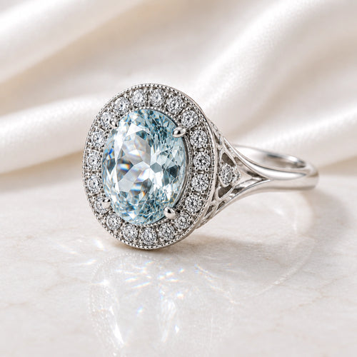 Aquamarine vintage-style halo ring in white gold