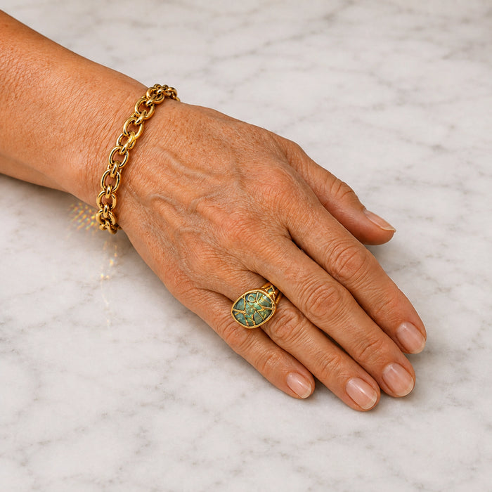 Gold bracelet and ring being checked as part of regular jewellery maintenance