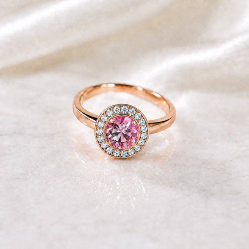 Pink tourmaline round halo ring in rose gold