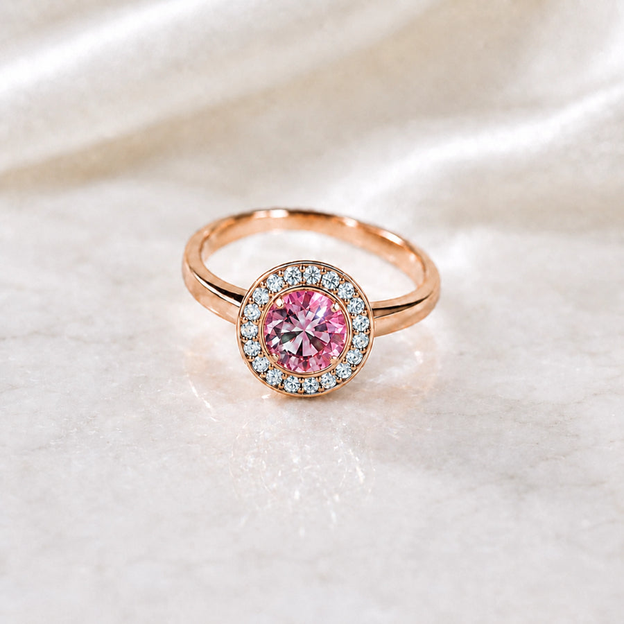 Pink gemstone ring on satin representing a personalised replacement piece