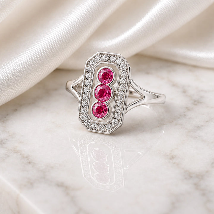 Ruby trilogy halo ring photographed for a client story